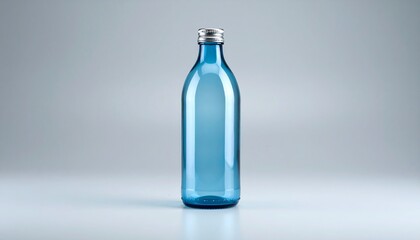 Naklejka premium Clear Blue Glass Bottle with Silver Cap Mockup Product