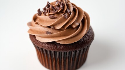 A delicious chocolate cupcake with decorative frosting and chocolate chips