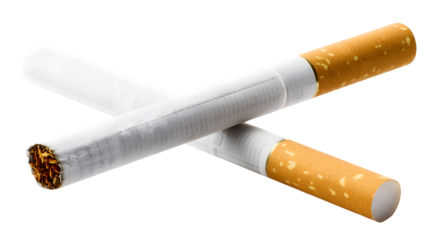 Close-up of two intersecting cigarettes with filter and tobacco showing against a black background