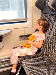 Little girl travels by train