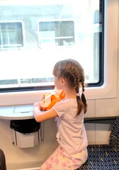 Little girl travels by train