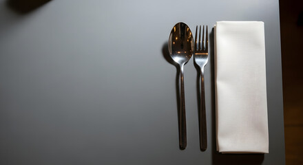 Fork and knife setup on dark table