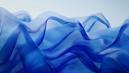 Obraz premium Blue translucent fabric drapes in soft folds.