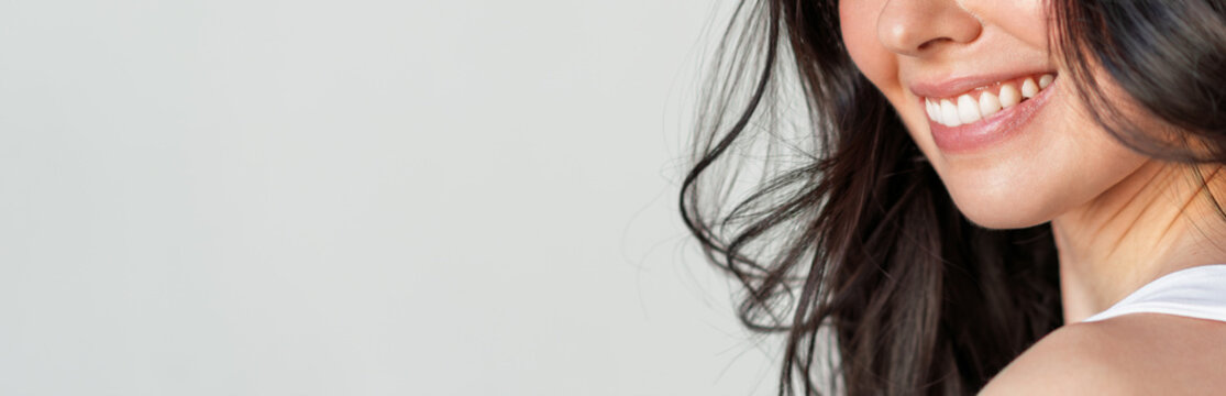 Closeup of woman smiling with perfect white teeth