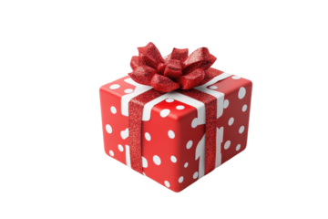 Red Christmas gift box decorated with white polka dots and a glittery ribbon surrounded by holiday ornaments