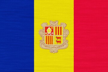Wooden texture painted in colors of flag of Andorra. Flat view