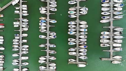 a marina with sailing ships – drone aerial photography
