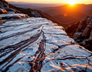 Striking Sunset Over Mountain Ridge Textured White and Gray Rock Cliff, Warm Golden Light