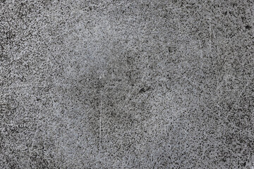 texture of flat cast iron surface with scratches and black stains