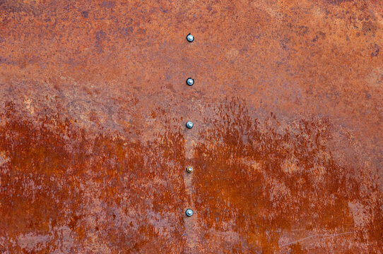 Rusty metal row of hexagonal heads