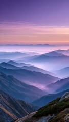 Obraz premium Dreamy mountain landscape with layers of fog and pastel colors