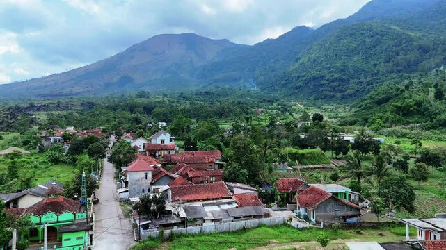 West Java, Indonesia - April 8, 2025: Aerial view drone shot of mount Guntur and village in Garut