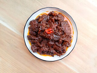 Beef rendang, a flavorful and spicy meat dish originating from the Minangkabau region of West Sumatra, Indonesia. Popular dishes