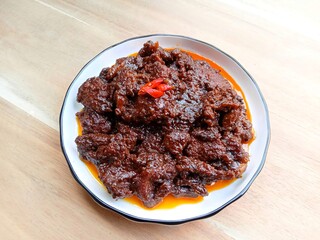 Beef rendang, a flavorful and spicy meat dish originating from the Minangkabau region of West Sumatra, Indonesia. Popular dishes