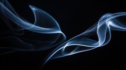 Naklejka premium Ethereal light-blue smoke swirls and twists elegantly against a stark black background, forming graceful, flowing shapes with varying concentrations and wispy textures. The luminous smoke creates a st