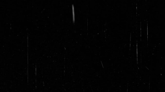 Vintage film scratches and grain texture overlay with dust particles, linear scratches, noise effects, and cluttered imperfections on black background overlay