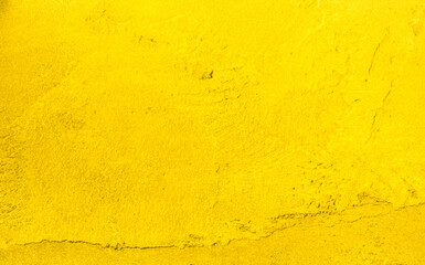Yellow cement background summer wallpaper banner, plaster stucco wall floor backdrop.