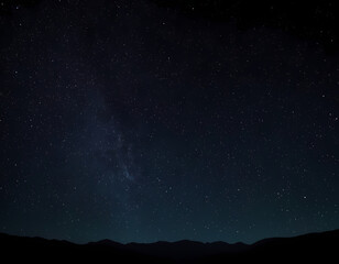 Fototapeta premium A magical night sky with glowing stars and a crescent moon, ample copy space, starry night sky