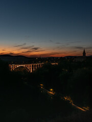 Viaduct between two hills in Veszprém at dusk.