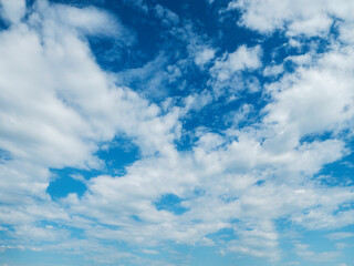 Calm blue cloudy sky. Nature background. Scenic cloudscape.