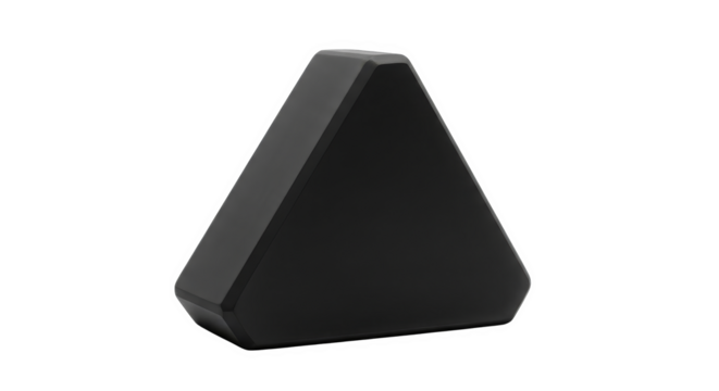 A smooth, black triangular object stands out against a stark black backdrop, modern design object.