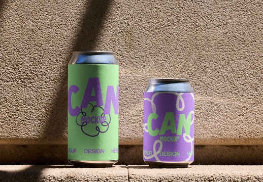 Two blank can mockups stand side by side on a rough textured surface, showcasing their design potential in bright lighting conditions. PSD template mockup.