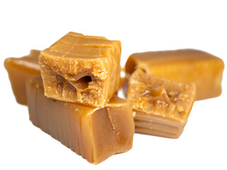 sweet caramel fudge close-up, cross-section and whole on a white background