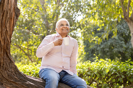 Happy senior man relaxing at park