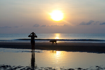 Fototapeta premium Sunrise and silhouette traveler
