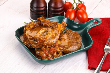 Italian cuisine - ossobuco with sauce