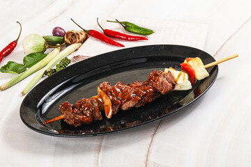 Asian grilled beef skewer with vegetables and pineapple