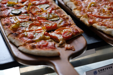 home made ellipse pan pizza on served