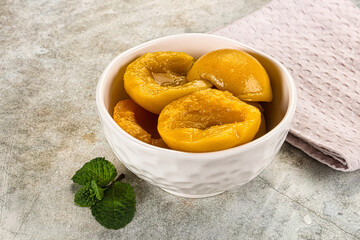 Canned marinated peach in syrop