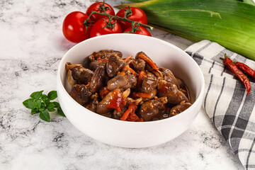 Baked chicken hearts with vegetables