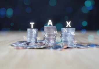 TAX icon on a stack of coins. Concept of taxes paid by individuals and companies, VAT, income tax, property tax, property tax, Background for your business.