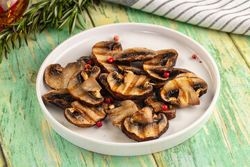 Tasty hot grilled champignon mushrooms
