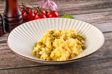 Scrambled egg omelet with green peas