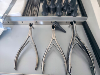 Surgical instruments neatly organized in a stainless steel tray at a medical facility