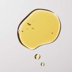 Argan oil liquid texture minimalist background 3d rendering, yellow serum drops on white, natural cosmetic concept.