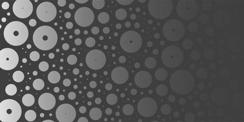 A monochromatic abstract pattern of overlapping circles with varying sizes forming a textured and dynamic design on a dark background.