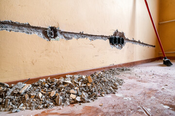 Preparation on wires and cables on the wall. switches concept. making new electricity in house
