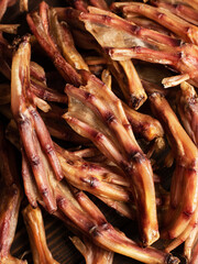 dry duck feet close up. snack for dogs