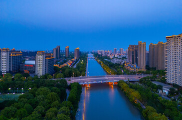 Obraz premium Aerial view of urban scenery in the suburbs of Shanghai at sunset.