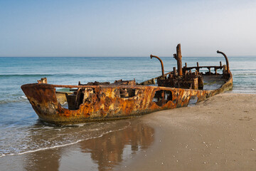 Rusty Shipwreck on the Shore of the Mediterranean Sea