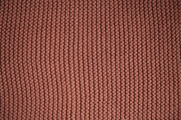 brick texture of knitted fabric, macro texture of dark pink wool fabric, geometric knitted pattern with crocheted elastic as a background