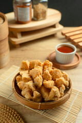 Indonesian Snack Food. Bakso Goreng or Deep Fried Meatball. Made from Chicken, Meat, or Shrimp with Flour. Served with Spicy Sauce. Perfect for recipes, articles or any cooking content.
