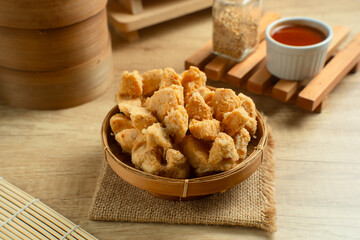 Indonesian Snack Food. Bakso Goreng or Deep Fried Meatball. Made from Chicken, Meat, or Shrimp with Flour. Served with Spicy Sauce. Perfect for recipes, articles or any cooking content.