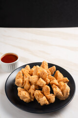 Indonesian Snack Food. Bakso Goreng or Deep Fried Meatball. Made from Chicken, Meat, or Shrimp with Flour. Served with Spicy Sauce. Perfect for recipes, articles or any cooking content.