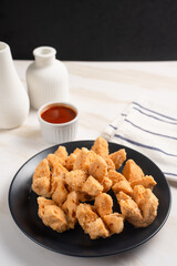 Indonesian Snack Food. Bakso Goreng or Deep Fried Meatball. Made from Chicken, Meat, or Shrimp with Flour. Served with Spicy Sauce. Perfect for recipes, articles or any cooking content.