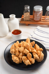 Indonesian Snack Food. Bakso Goreng or Deep Fried Meatball. Made from Chicken, Meat, or Shrimp with Flour. Served with Spicy Sauce. Perfect for recipes, articles or any cooking content.
